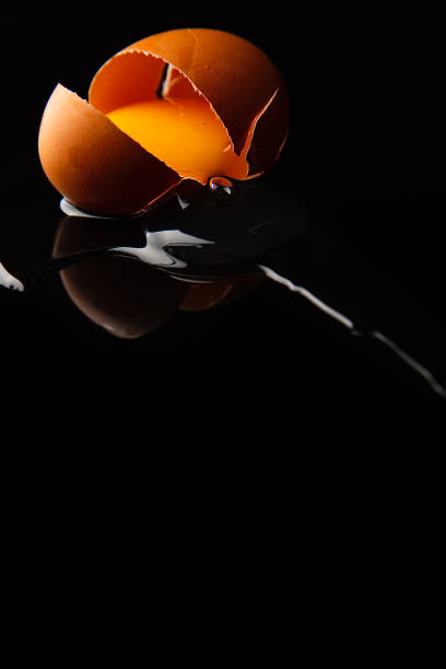istock An egg falls and cracks, the shell breaks, and the egg runs out, close-up - stock photo 1437405590