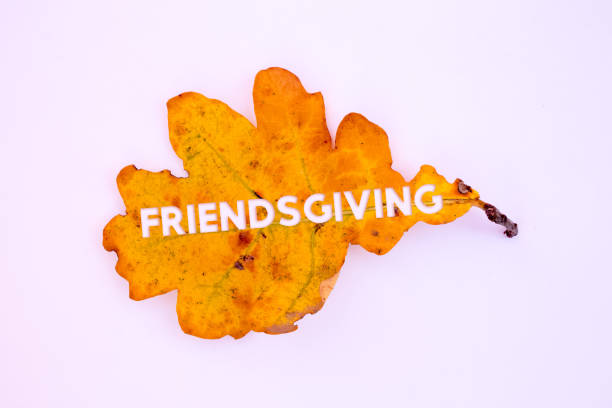 istock Autumn leaves, objects with Friendsgiving text. Natural patterns, color design. 1437409338
