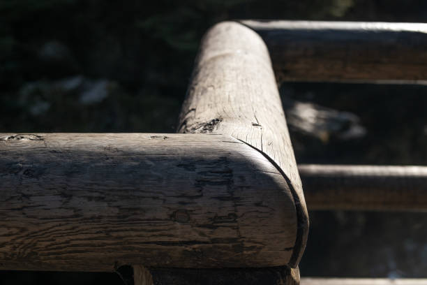 istock Rustic wood fence corner with heavy light and shadow. 1437409378