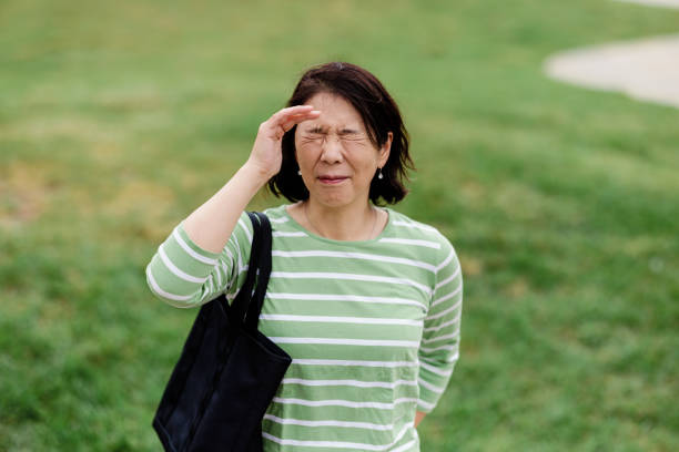 istock Woman outdoors with a headache 1437410477