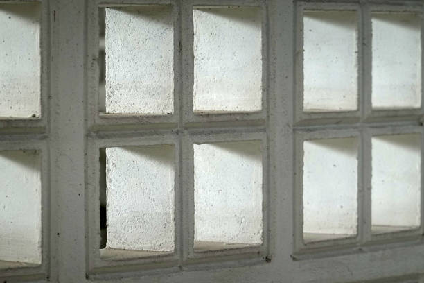 istock White brick of air ventilation pattern at  concrete building, light and shadow. 1437414198