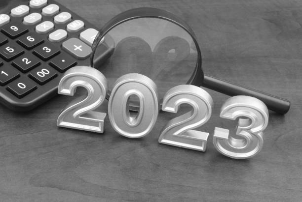 istock Magnifying glass and calculator with numbers 2023. 1437422835