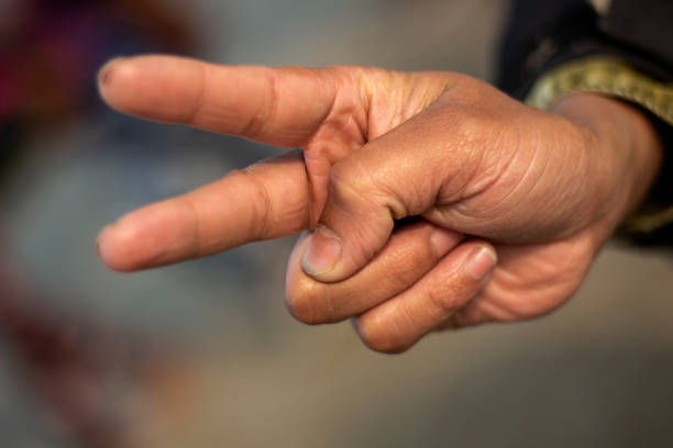 istock Showing two fingers like devil horns and the background blur 1437423914