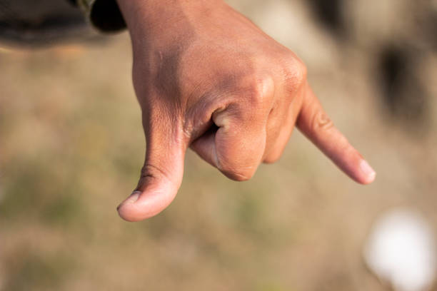 istock Showing two fingers like devil horns and the background blur 1437423978