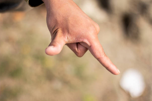 istock Showing two fingers like devil horns and the background blur 1437423984