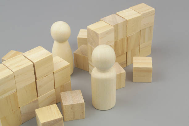 istock Breaking wall of misunderstanding between men and women. People figures and broken wall. 1437429687