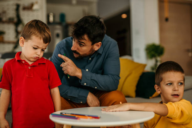 istock Parent disciplining and talking to his boy 1437429703