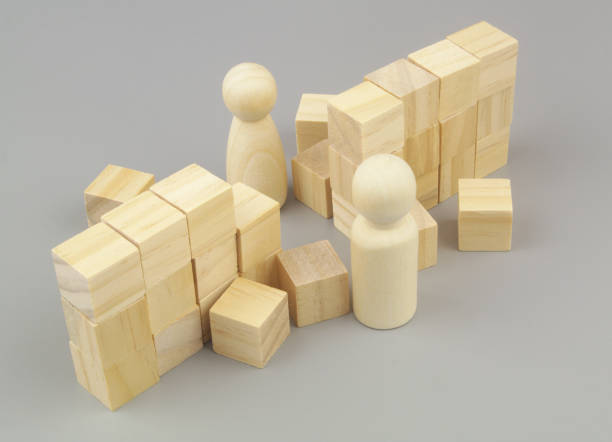 istock Breaking wall of misunderstanding between men and women. People figures and broken wall. 1437430389