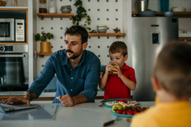 istock Dad and boys having a breakfast together 1437432966