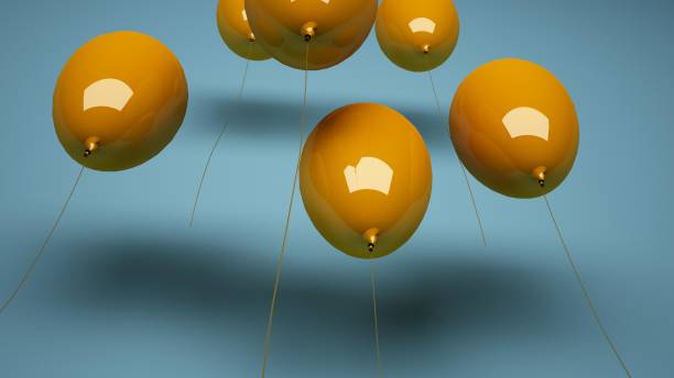 istock Yellow balloons from below on blue background, 3D render 1437433786