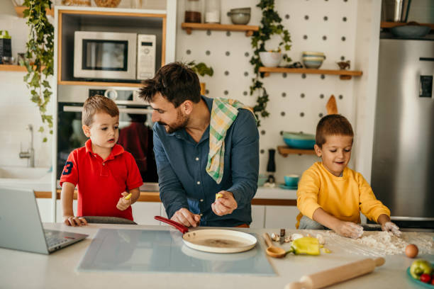 istock Family cooking together 1437433910