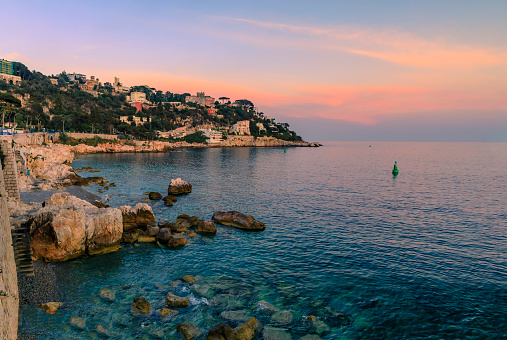 Stunning view of the Mediterranean Sea in the harbor and exclusive Mont Boron hill neighborhood at sunset in Nice, South of France or French Riviera