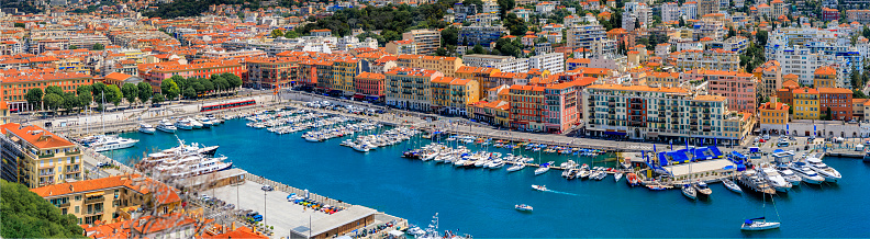 Panoramic view of boats in the marina and waterfront buildings in Nice port on the Mediterranean Sea, Cote d'Azur, France