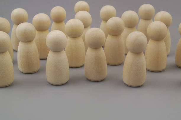 istock Group of people figures on gray background 1437435271