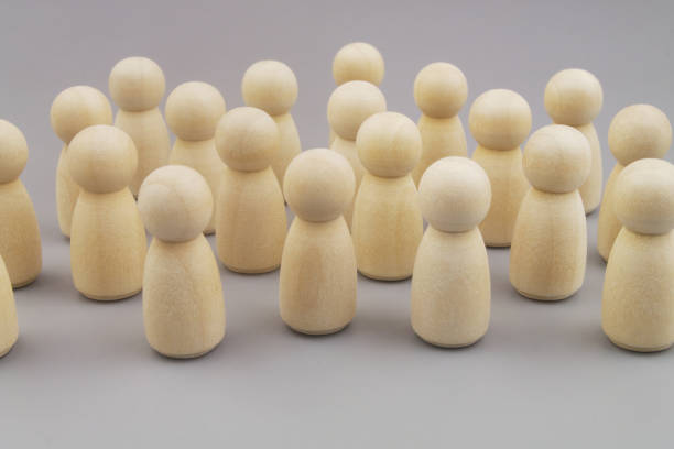 istock Group of people figures on gray background 1437435636