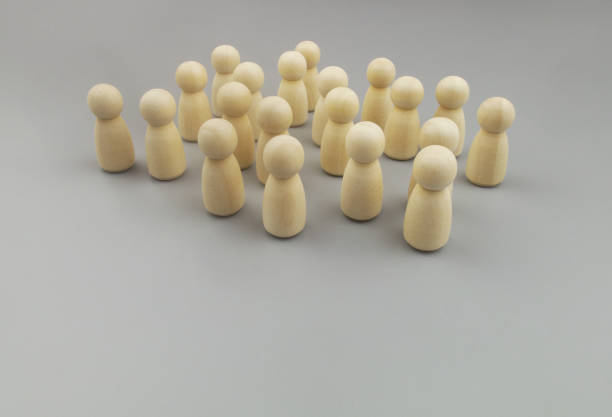 istock Group of people figures on gray background 1437435639