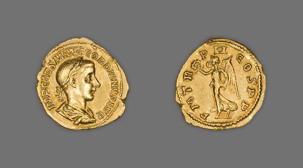 istock Top view of ancient gold coins isolated on gray surface background 1437436514