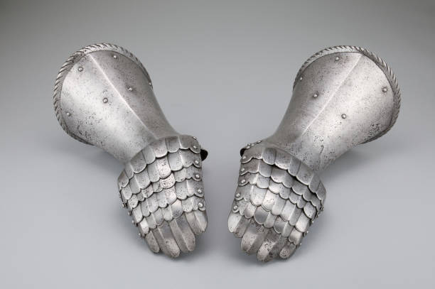 istock Pair of antique rusty gauntlets on a white background 1437436691