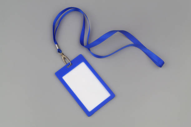 Blue badge with blue ribbon on gray background stock photo