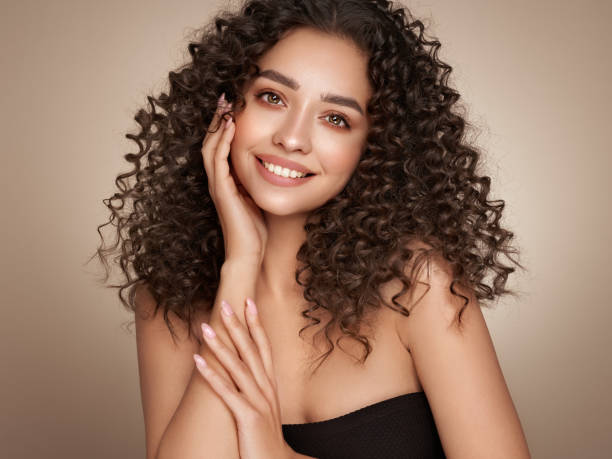istock Beautiful smiling woman with afro curls 1437437830