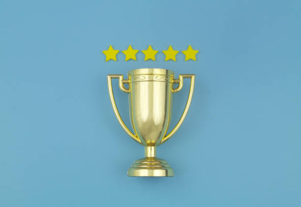 istock Gold champion trophy cup with five stars 1437440262