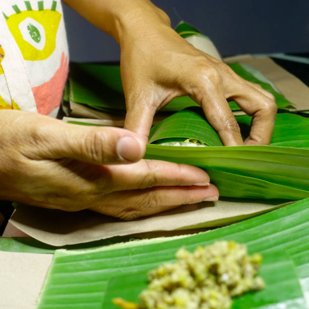 istock Wrapping up with banana leaf. 1437440514