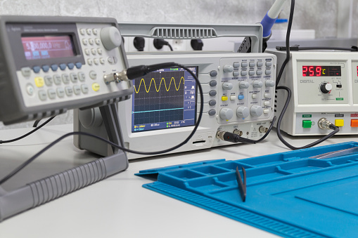 Power supplies and electronic measuring devices in the laboratory.Electronic measuring instruments in science lab.