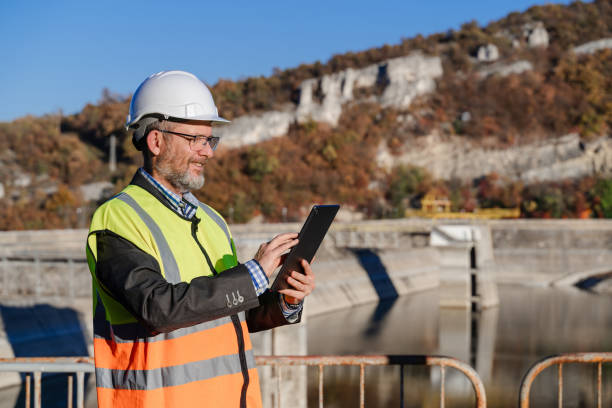 istock Mature male engineer working with a digital tablet in the hydroelectric dam 1437444596