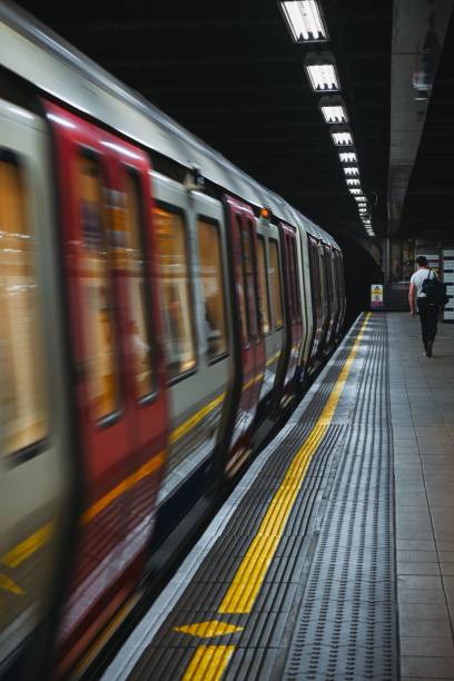 istock Vertical shot of a train moving along platform at the underground station 1437447527