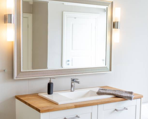 istock Horizontal shot of a bathroom mirror and a sink at a nicely designed bathroom 1437450511