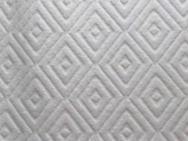 istock Closeup shot of a diamond shape pattern on white fluffy textile 1437450746