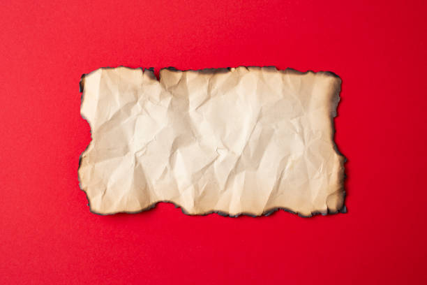 istock Vintage crumpled paper with burned edges 1437452404