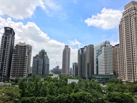A beautiful view of modern buildings under a cloudless blue sky in Taichung, Taiwan