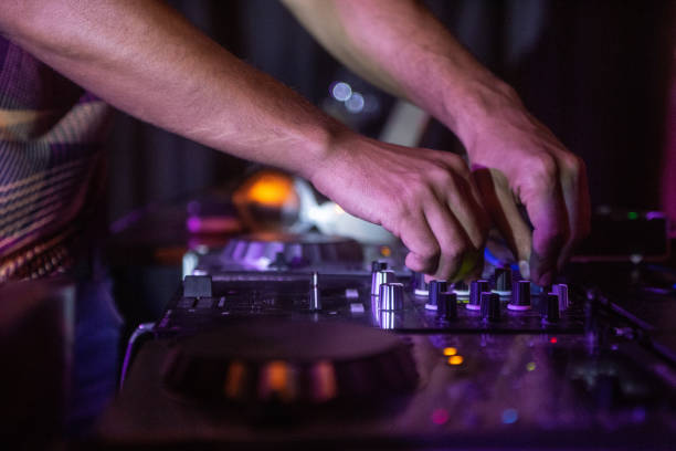 istock Selective focus shot of black DJ controller with hands of DJ 1437456223