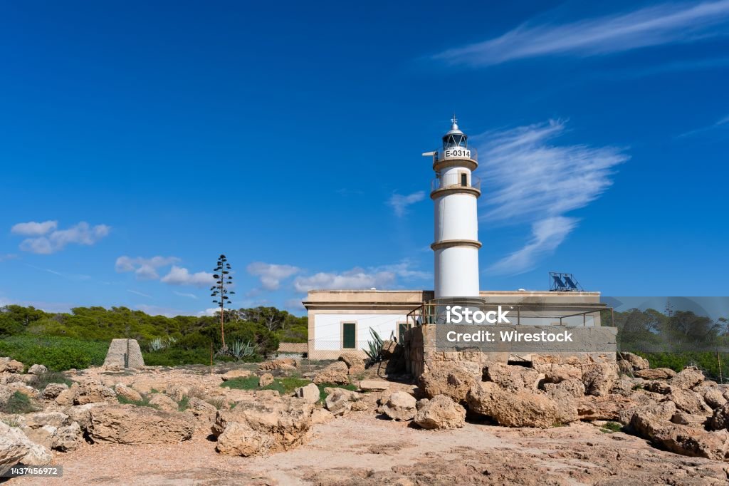 Lighthouse on Cap de Ses Salines, Mallorca, on a clear sunny day The lighthouse on Cap de Ses Salines, Mallorca, on a clear sunny day Balearic Islands Stock Photo