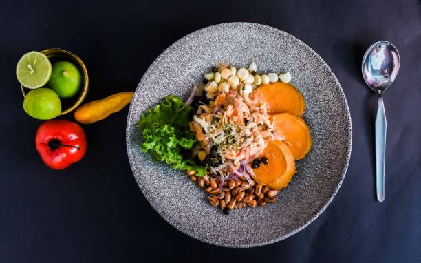 istock Delicious Peruvian ceviche dish in a beautiful plate on black surface 1437457359