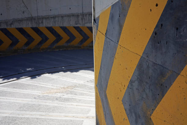 istock yellow and blue traffic lines on old concrete wall 1437457911