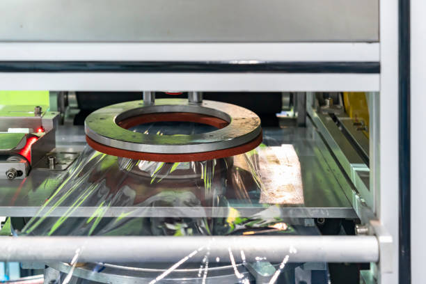 istock Automatic plastic stretch film wrapping or packing machine for goods or product etc in industrial work 1437458515