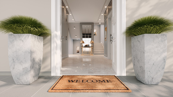 Welcome text on doormat, real estate concept