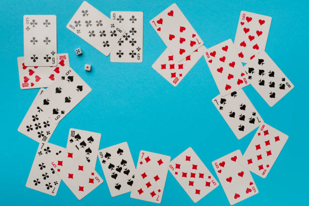 istock Playing cards on color background. Gambling concept. Top view 1437459429
