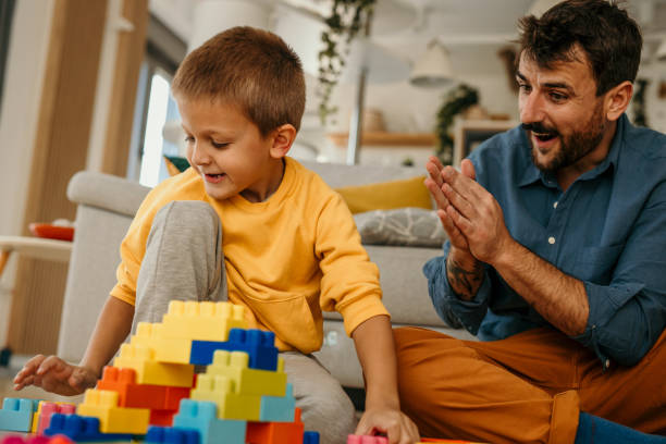 istock Teacher and a kid playing 1437459753