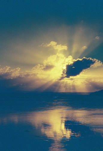 Dramatic skies as the sun sets behind clouds over a beach in Devon, Westward Ho! 35mm photo
