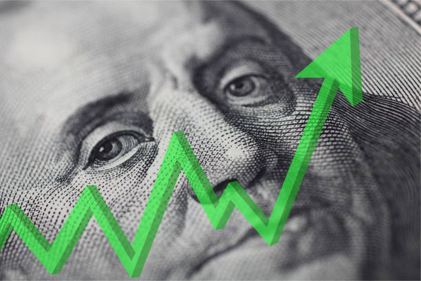 istock Green Arrow Moving Up Over One Hundred American Dollar Bill 1437464539