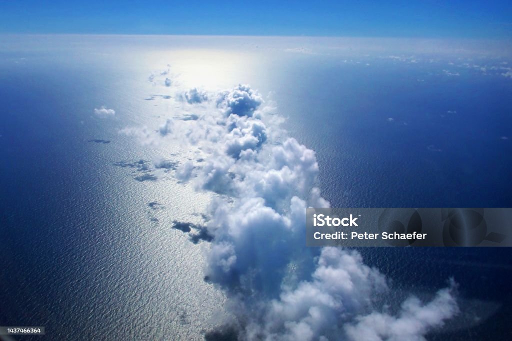 Clouds over ocean Luftaufnahme über Wolken auf See Above Stock Photo