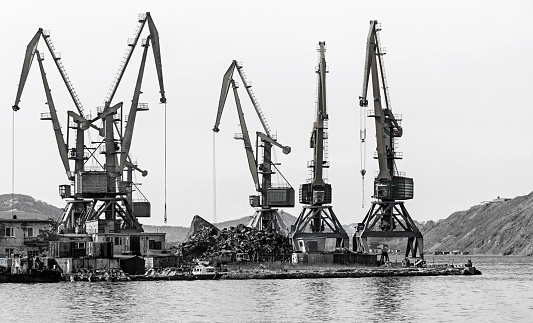 The crane at the scrapyard in the seaport in Kamchatka Peninsula