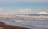 Pacific ocean, Kamchatka peninsula. Winter sunny landscape of the ocean coast