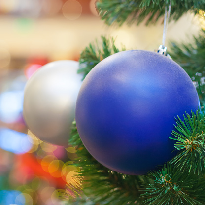 Close-up of a Christmas tree with blue and white decorative balls