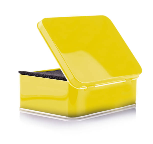istock Closed Empty yellow metal box close-up isolated on white background 1437475205