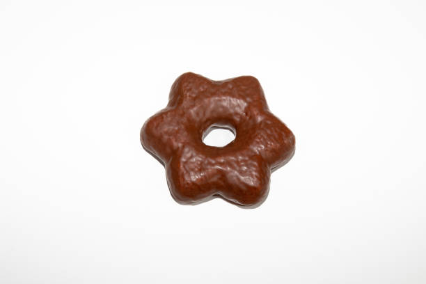 istock Gingerbread star biscuit covered in chocolate and isolated on white background 1437476459