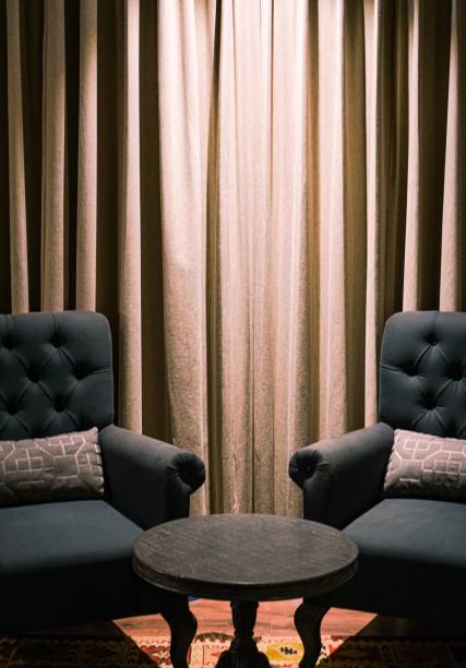 istock Vertical shot of two armchairs near a small table 1437479110